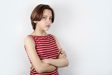 The concept of rejection, misunderstanding. A young girl is a teenager 13-14 years old with a sad...