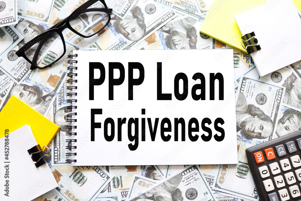 Poster paycheck protection program ppp loan forgiveness. background with money, dollar bills. text on an op