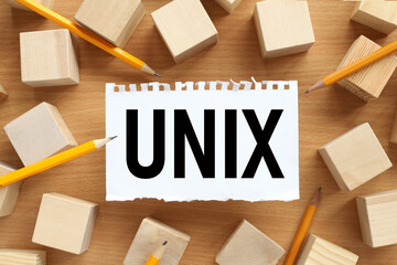 UNIX. text on white torn paper. near the wooden cubes