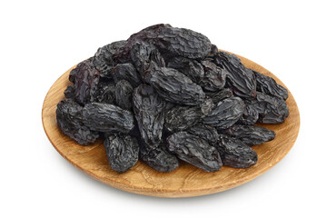 Yellow raisins in wooden bowl isolated on white background with clipping path and full depth of field