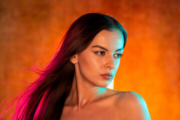 Portrait shot of a pretty young woman in RGB colors.