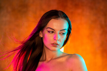 Portrait shot of a pretty young woman in RGB colors.