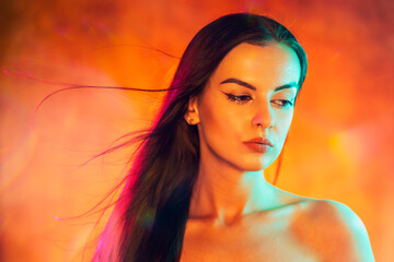 Portrait shot of a pretty young woman in RGB colors.