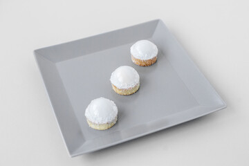 Tartlets on a stylish gray plate in a restaurant, on-site catering, a delicious and stylish dessert