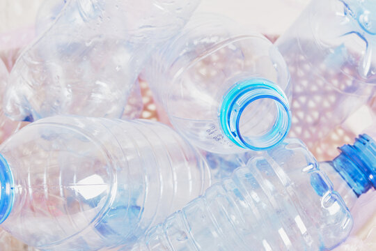collection of plastic bottles in the trash can