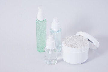 Composition of different cosmetic bottles mock-up on gray background