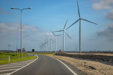 Windmill in grass field