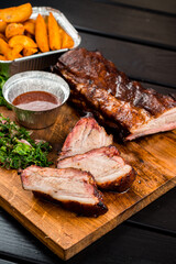 BBQ grilled ribs on a wooden board