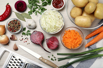Fresh ingredients for borscht on white wooden table, flat lay