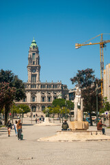 Porto City Hall in the Avenida dos Aliados and a statue of a naked woman, lifestyle of Porto - Vertical, Portugal.