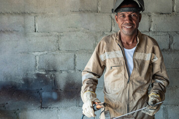 Industrial welder standing in the factory