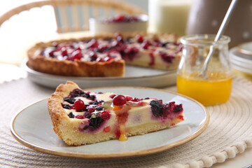 Piece of delicious currant pie with honey on table indoors, closeup
