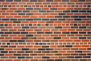 Brick wall as a rough textured and patterned abstract background
