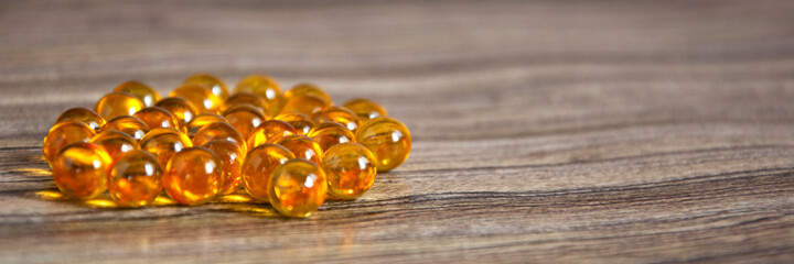 Wooden background with medical supplies. Omega-3 fish oil. Tablets on the table. Medicine concept.