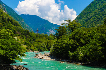Fototapeta na wymiar Blue river on a sunny day in Abkhazia