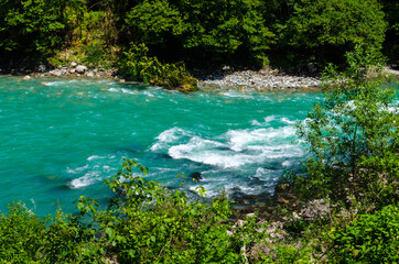 Blue river on a sunny day in Abkhazia