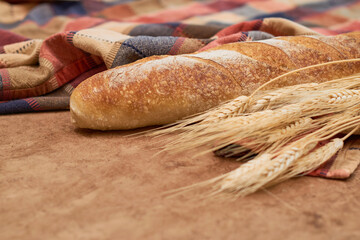 Homemade Sourdough Bread baguette on a rustic background. Vegan food Concept.