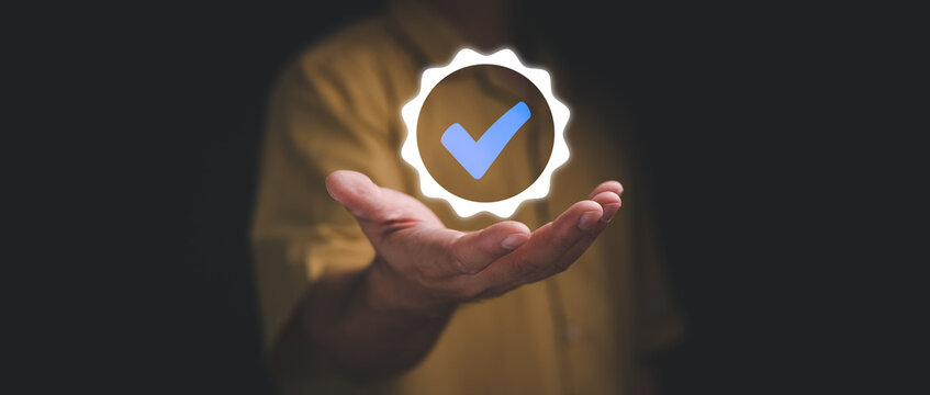 Hand shows the sign of the top service Quality assurance, Guarantee, Standards, ISO certification and standardization concept.