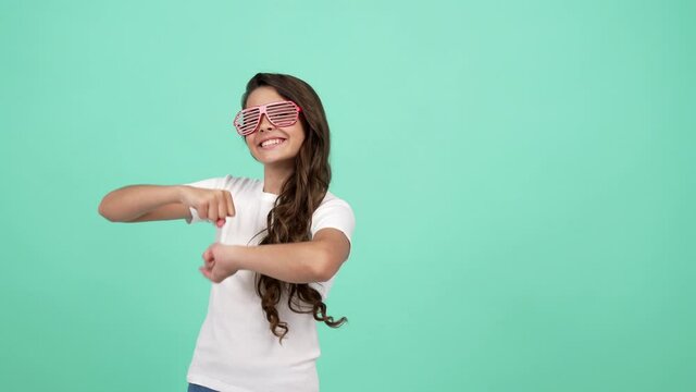 happy kid in glamour glasses having party fun and dancing showing peace gesture, fashion accessory.
