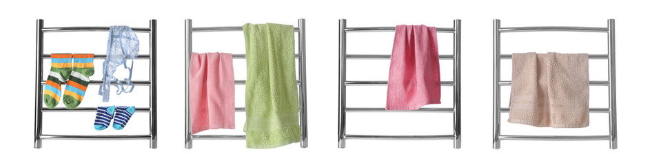 Set with modern heated towel rails with clothes and towels on white background. Banner design