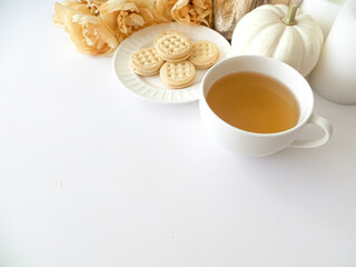 Obraz na płótnie Canvas mini pumpkin cookies and tea flat lay scene 