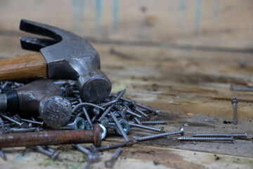 Hammer and Nails on wooden background