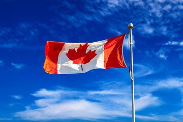 Canadian flag against blue sky