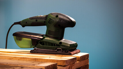 Electrical sander in a workshop