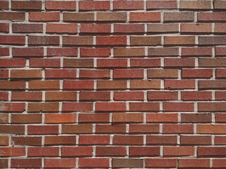 red and brown brick wall. house exterior.