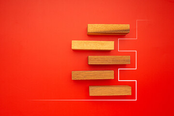 Top view of five empty wooden blocks with line effect isolated on a red background. Space for text
