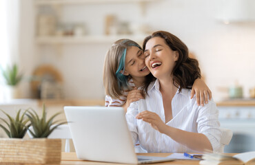 mother with child working on the computer