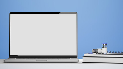 Laptop blank screen mockup, vaccine bottles, medical books on doctor or pharmacist office desk