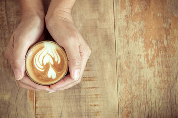 cup of coffee in woman hands