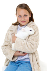 Stylish girl holding white rabbit