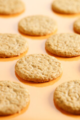 sweet cookies on orange color background.
