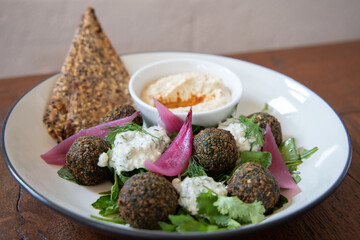 Healthy vegan salad  with falafel and greens for lunch. Organic, tasty food concept. Clean eating, Dieting, Detox, Vegan food