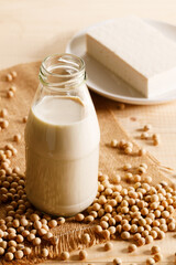 soy milk in a bottle on wooden table
