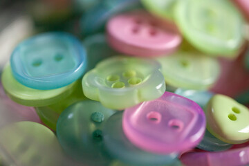 Baby pink, yellow and blue buttons