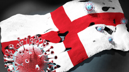 Fototapeta premium Covid in United Kingdom - coronavirus attacking a national flag of United Kingdom as a symbol of a fight and struggle with the virus pandemic in this country, 3d illustration