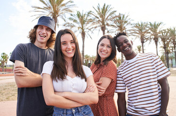 Portrait of young handsome interracial erasmus students. Group of happy students looking at the...