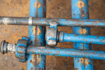 Heavy duty pipeline part with hammer union for connection, normally it using as fluid flowing transfer temporary line in refinery plant. Industrial equipment object. Selective focus.