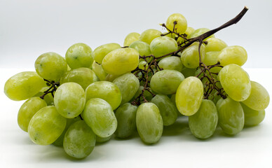 Fresh green grapes isolated on white background.