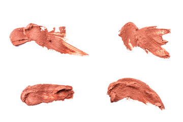 Variety of wet red cosmetic clay smears isolated on white background. Abstract sample of pink...