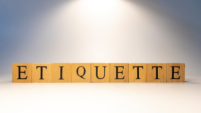 The word Etiquette was crafted from wooden cubes for finance and business.
