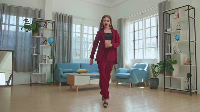 Young Fashion Shemale Wearing Red Clothes Walking And Posing In Home
