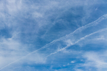 Naklejka na ściany i meble Two tracks from aircraft in the sky