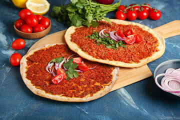 Board with delicious Turkish pizza on color background