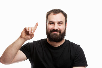 Fototapeta premium The man with the beard raised his index finger up. I have an idea! White background.
