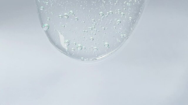 Cosmetics serum fluid gel, hyalurinic acid cream texture, facial treatment