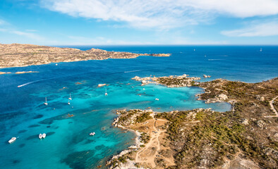 Naklejka na ściany i meble View from above, stunning aerial view of La Maddalena Archipelago with its turquoise, crystal clear bays of water. Caprera Island in the distance. Sardinia, Italy.